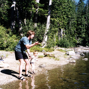 Bryden and dad throwing rocks in the lake